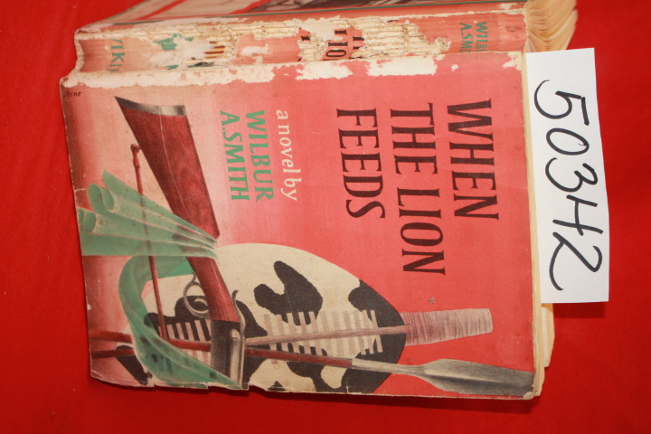 Smith, Wilbur author signed  inscribed and dated sept 1993: When the Lion Feeds
