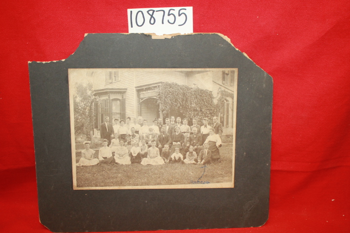 Mitchell: Puscal's Family Photograph front of victorian house